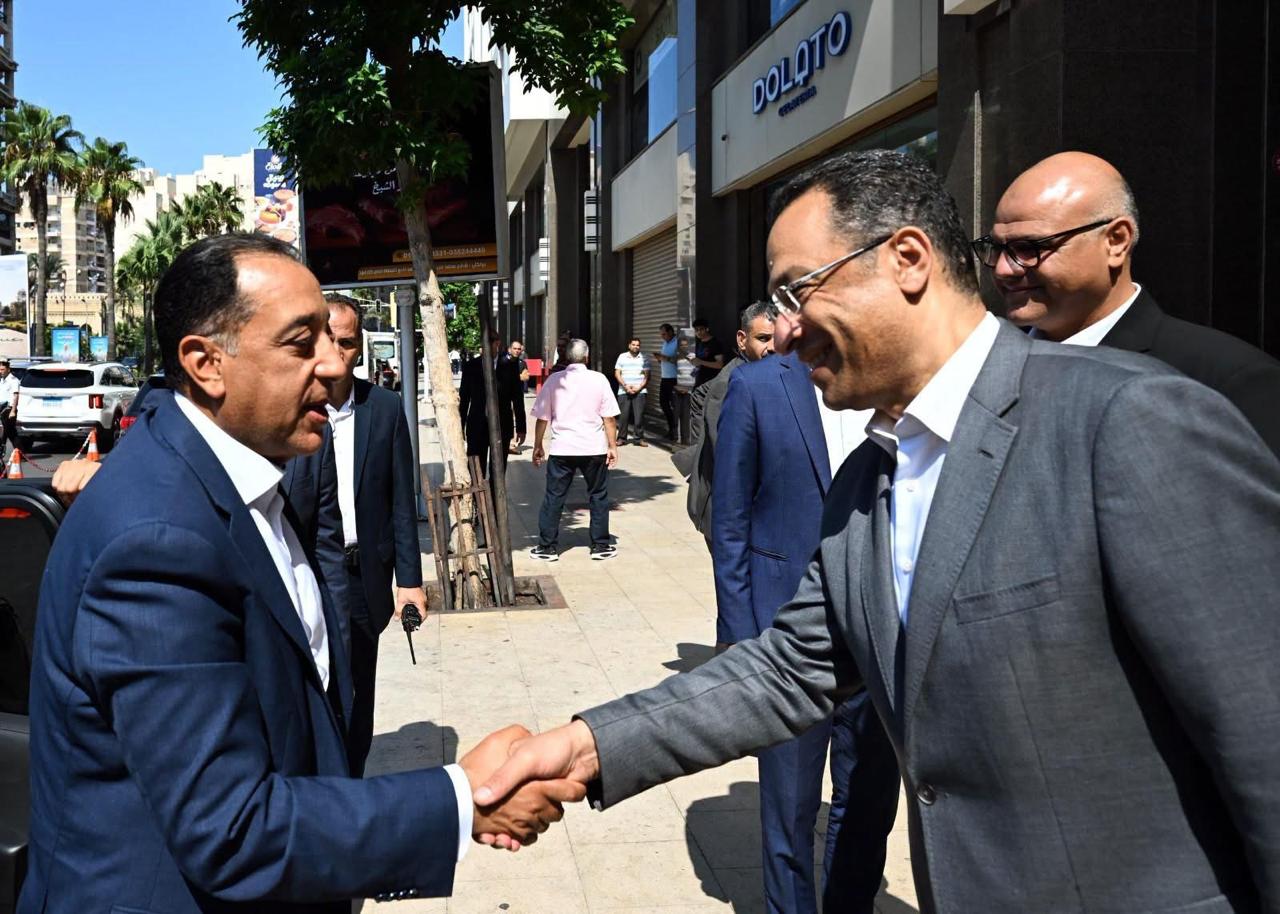 “Egyptian Prime Minister Mostafa Madbouly shaking hands with MCIT Minister Raafat Hindy alongside Alexandria Governor Ayman Atti