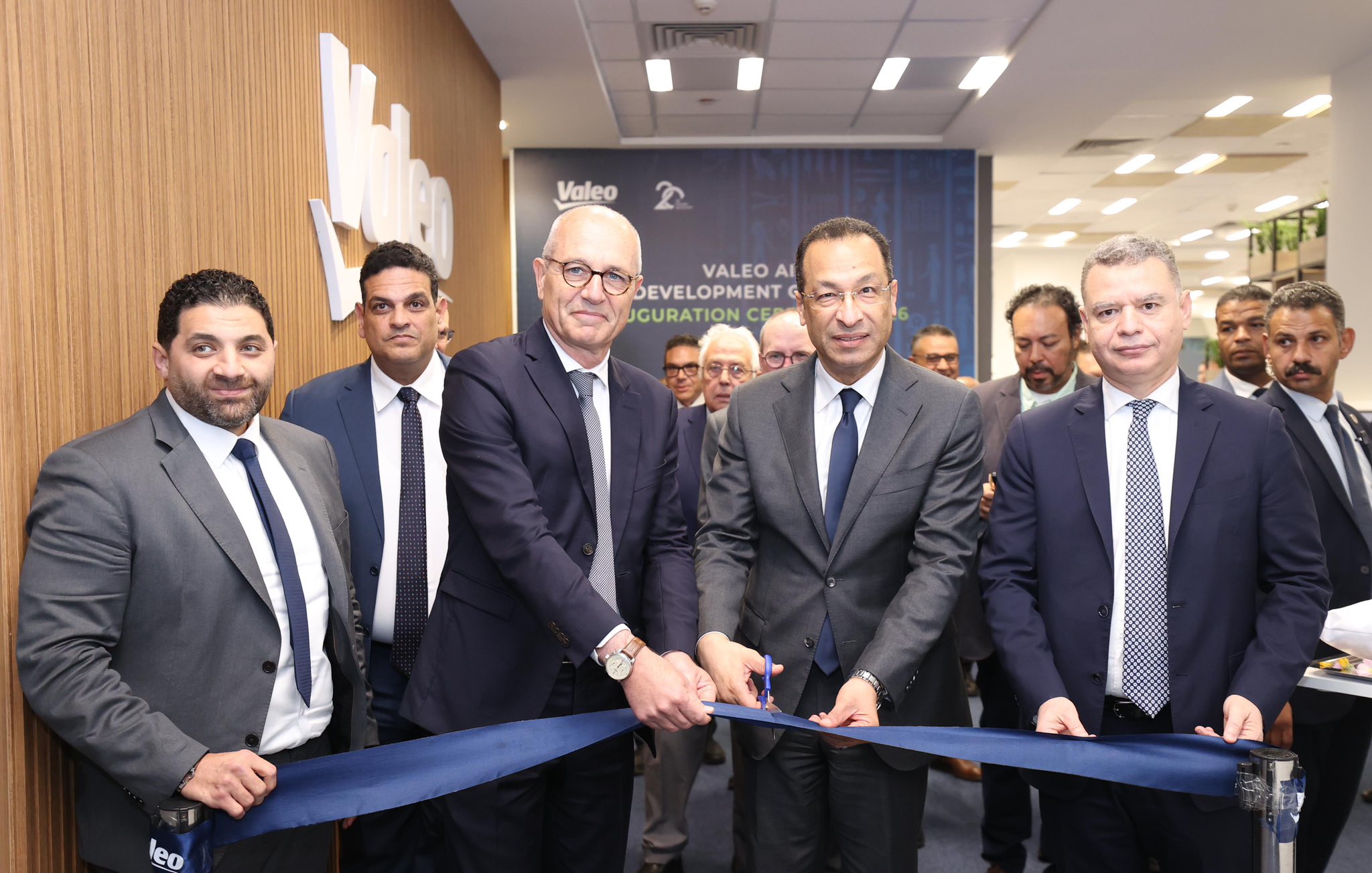 "H.E. Dr. Raafat Hendy, Minister of ICT, cuts the ribbon for Valeo’s AI Development Center in Smart Village. He is flanked by Va